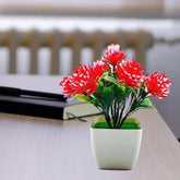 مجموعة واحدة من الزهور الاصطناعية المزروعة في أصيص